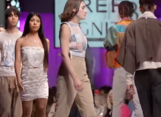 A Nebraska fashion designer is facing backlash after featuring a swastika-adorned jacket on their runway, sparking outrage and accusations of offense.