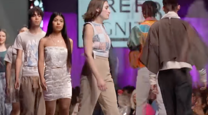 A Nebraska fashion designer is facing backlash after featuring a swastika-adorned jacket on their runway, sparking outrage and accusations of offense.