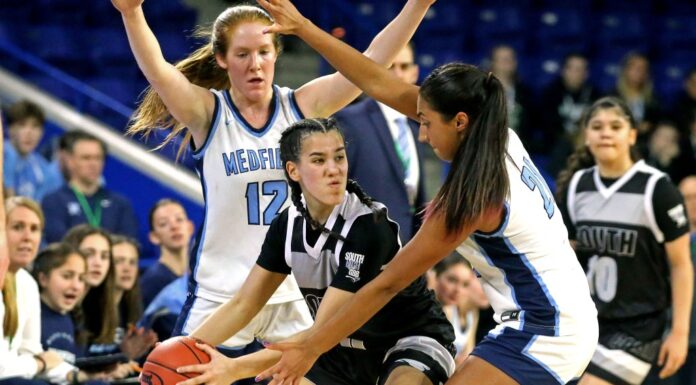 Medfield successfully defends its Division II girls’ basketball championship in a dominant performance.