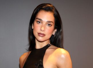 Dua Lipa showcased her edgy, eclectic style as she donned a breezy black outfit with bohemian and cowgirl elements.