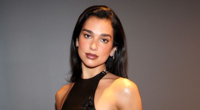 Dua Lipa showcased her edgy, eclectic style as she donned a breezy black outfit with bohemian and cowgirl elements.